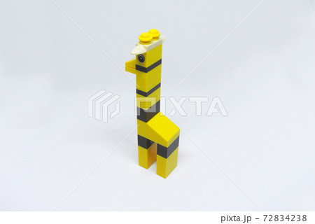 The shape of a giraffe made from colorful plastic toy bricks isolated on white background. The shape of a giraffe made from colorful plastic toy bricks isolated on white background. 72834238