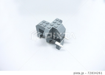 The shape of an elephant made from colorful plastic toy bricks isolated on white background.  72834261