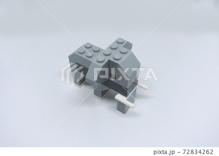 The shape of an elephant made from colorful plastic toy bricks isolated on white background.  72834262