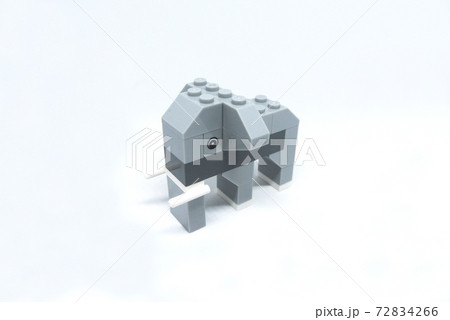 The shape of an elephant made from colorful plastic toy bricks isolated on white background.  72834266