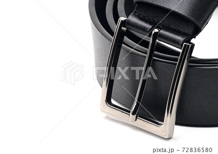 Black belt with a metal fastener on a white background Black belt with a metal fastener on a white background 72836580