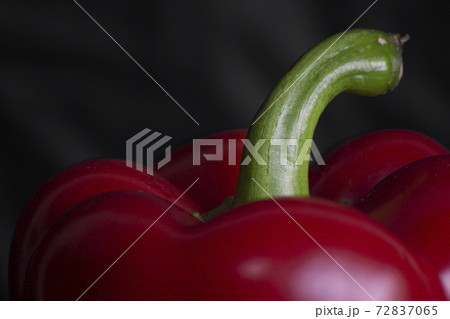 Fresh red sweet bulgarian pepper isolated on black background Fresh red sweet bulgarian pepper isolated on black background 72837065