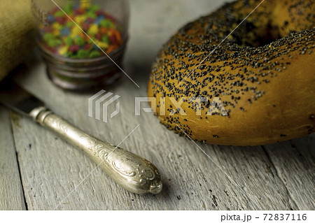 sweet buns on a rough wooden background 72837116
