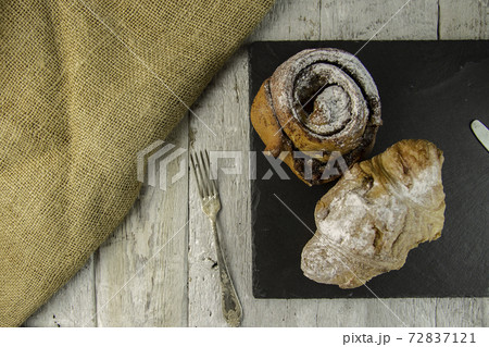 sweet buns on a rough wooden background sweet buns on a rough wooden background 72837121