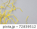 Abstract gray background with bright yellow wavy paper stripes. 72839512