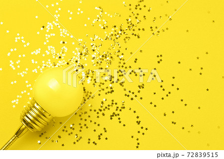 One yellow decorative lamp on a gray background. One yellow decorative lamp on a gray background. 72839515