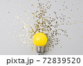 One yellow decorative lamp on a gray background. 72839520