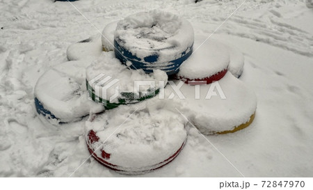 Snow-covered small architectural forms in the playground 72847970