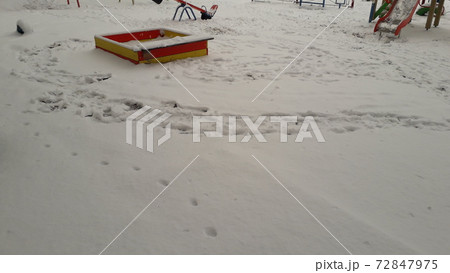 Snow-covered small architectural forms in the playground 72847975