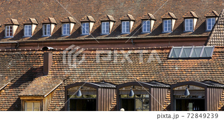 Tiled roof of medieval building in Wurzburg, Germany. 72849239