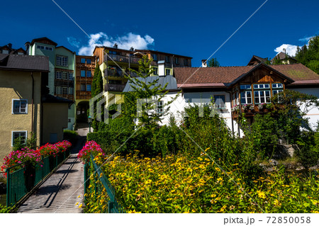 Picturesque Houses Beneath Mountain River In Bad Aussee In Austria 72850058
