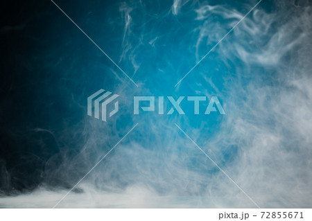 dense smoke on blue background dense smoke on blue background 72855671