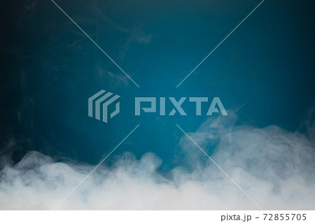 dense smoke on blue background dense smoke on blue background 72855705