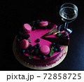 Delicious cake with fresh strawberries, raspberries, blueberry, currants. cut piece of cake and blade on wooden background. 72858725