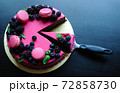 Delicious cake with fresh strawberries, raspberries, blueberry, currants. cut piece of cake and blade on wooden background. 72858730