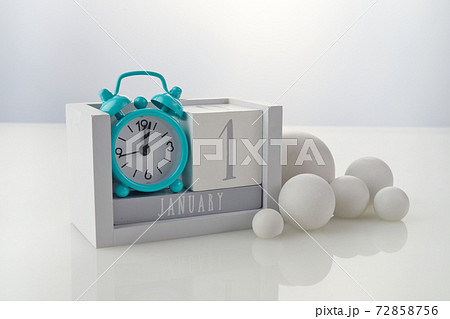 1 january wooden calendar with decorations on white table background 72858756