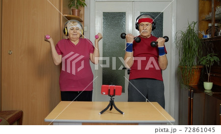 Senior elderly couple grandmother grandfather doing workout with dumbbells, fitness exercising 72861045