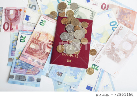 Cash on table isolated: dollars, euro, rubl broken money. All in mess, global crisis . passport travel concept Cash on table isolated: dollars, euro, rubl broken money. All in mess, global crisis . passport travel concept 72861166