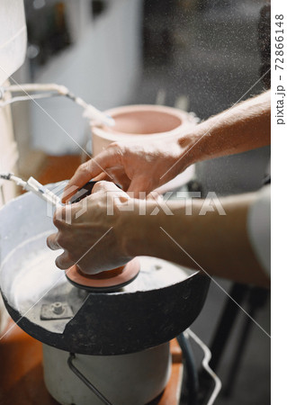 A man processes a bottle into a glass A man processes a bottle into a glass 72866148