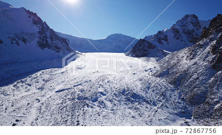 High rocks covered with snow. The Tuyuk Su Glacier High rocks covered with snow. The Tuyuk Su Glacier 72867756