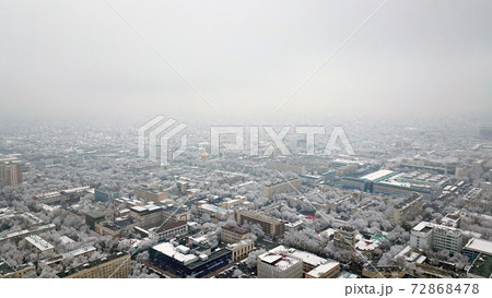 Top view through the clouds on the city of Almaty. Top view through the clouds on the city of Almaty. 72868478