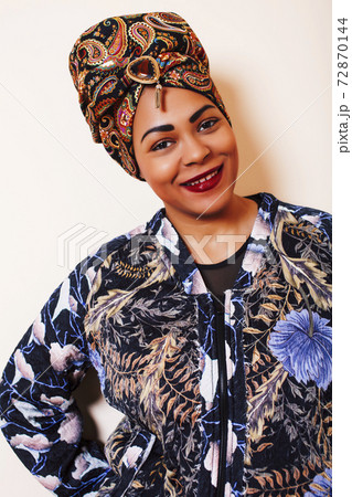 beauty bright african woman with creative make up, shawl on head like cubian closeup smiling beauty bright african woman with creative make up, shawl on head like cubian closeup smiling 72870144