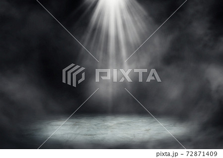 Studio dark room concrete floor grunge texture with spot lighting and fog or mist in black background. Studio dark room concrete floor grunge texture with spot lighting and fog or mist in black background. 72871409