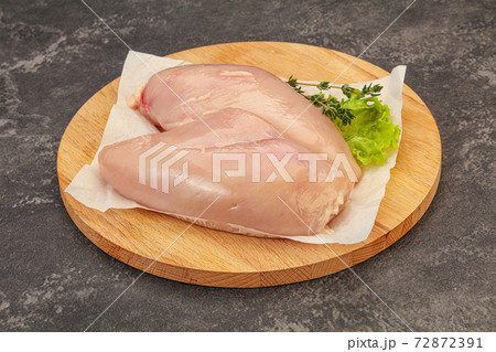 Raw chicken breast over board Raw chicken breast over board 72872391