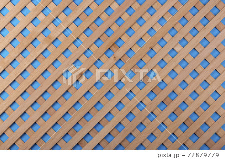 Texture of decorative wooden lattice with colored background Texture of decorative wooden lattice with colored background 72879779
