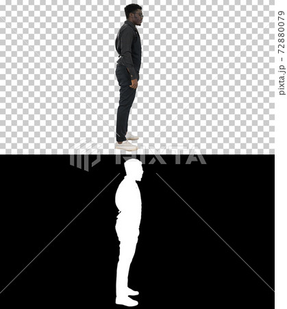 Young African American businessman in glasses standing and pulli Young African American businessman in glasses standing and pulli 72880079