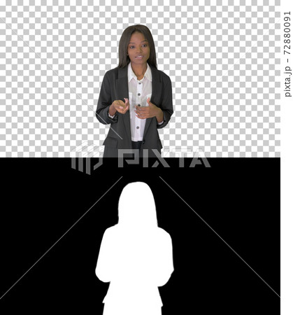 African American businesswoman explaining and gesturing while wa African American businesswoman explaining and gesturing while wa 72880091