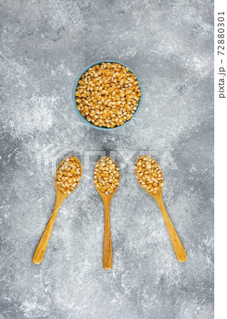 Bowl of corn kernels on marble background 72880301