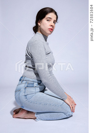Dark hair caucasian girl on grey Dark hair caucasian girl on grey 72881684