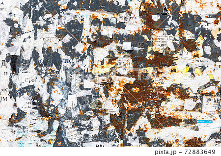 Weathered rusty metal texture with scraps of old paper as background Weathered rusty metal texture with scraps of old paper as background 72883649