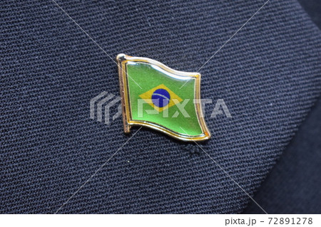 Brazil flag lapel pin on a suit 72891278