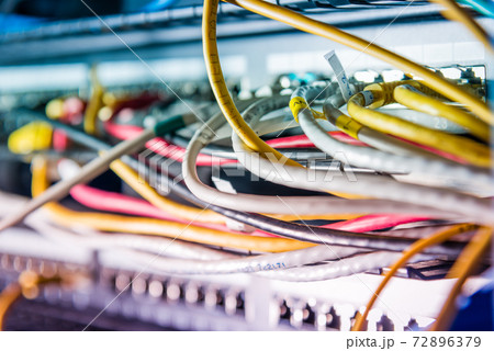 Server with patch cables plugged in ethernet ports Server with patch cables plugged in ethernet ports 72896379