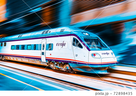 Modern hi-speed passenger train of Spanish Railways Company - Renfe, in  movement (motion). 72898435