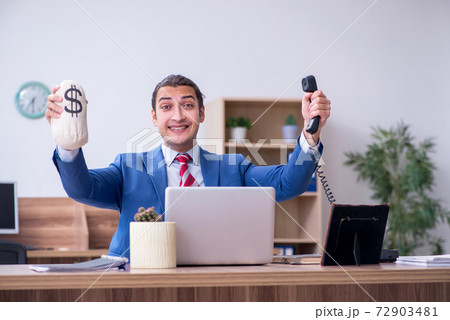 Young male employee in remuneration concept Young male employee in remuneration concept 72903481