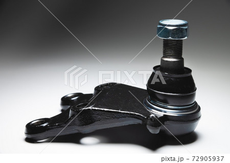 off-road Ball joint car suspension on a gray background. New spare parts axel car elements 72905937