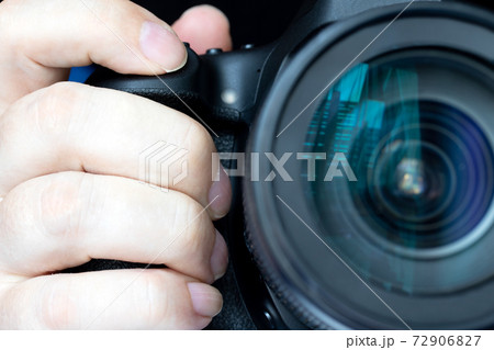 A pressing the shot button of a camera, close up. A take a picture. A pressing the shot button of a camera, close up. A take a picture. 72906827