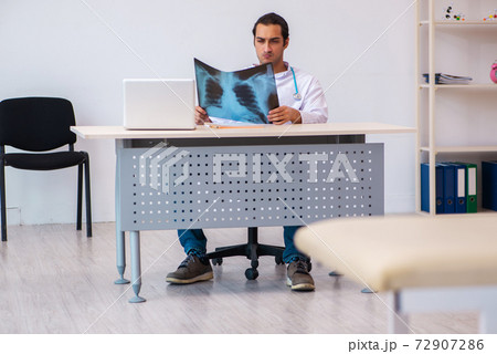 Young male doctor radiologist working in the clinic Young male doctor radiologist working in the clinic 72907286