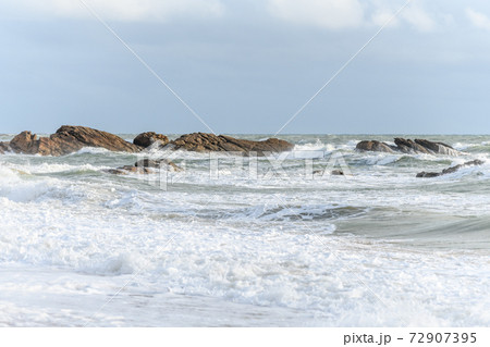 Waves breaking on the beach at the edge of the Atlantic Ocean. Waves breaking on the beach at the edge of the Atlantic Ocean. 72907395