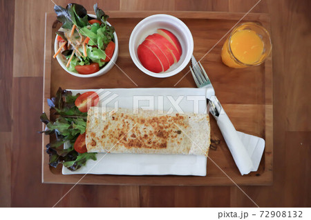 orange juice and taco ,vegetable roll or salad roll 72908132