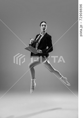 Young fashionable, stylish woman wearing jacket and socks working from home. Fashion during insulation 'cause of coronavirus pandemic Young fashionable, stylish woman wearing jacket and socks working from home. Fashion during insulation 'cause of coronavirus pandemic 72908696