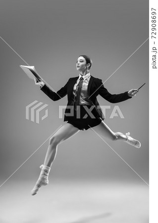 Young fashionable, stylish woman wearing jacket and socks working from home. Fashion during insulation 'cause of coronavirus pandemic Young fashionable, stylish woman wearing jacket and socks working from home. Fashion during insulation 'cause of coronavirus pandemic 72908697