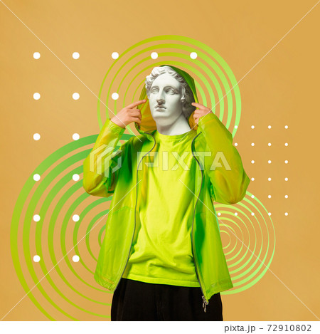 Stylish man headed by bright statue on background. Modern design. Contemporary colorful and conceptual bright art collage. Stylish man headed by bright statue on background. Modern design. Contemporary colorful and conceptual bright art collage. 72910802