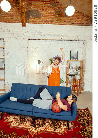 Gender stereotypes. Wife and husband doing things unusual for their genders in social meanings Gender stereotypes. Wife and husband doing things unusual for their genders in social meanings 72910929