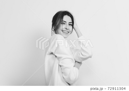 Portrait of beautiful woman isolated on white studio background. Comfort, warm in winter concept 72911304