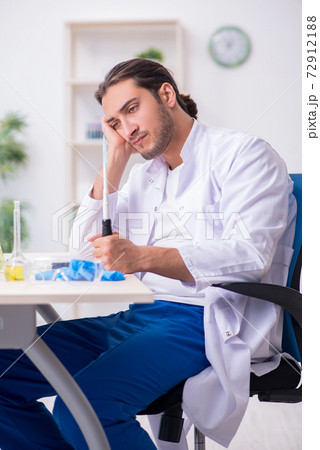 Young male chemist working in the lab Young male chemist working in the lab 72912188