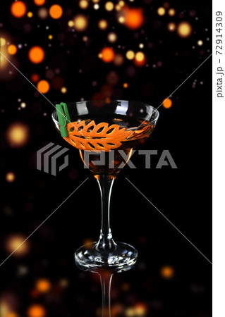 Cocktail Rob Roy .  Art in orange- fruits carving. 72914309